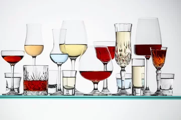 Fotobehang Various alcoholic drinks on a glass shelves. © Igor Normann