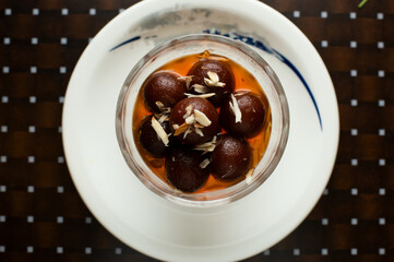 Gulab Jamun served in a dish isolated on table background top view of bangladesh sweet