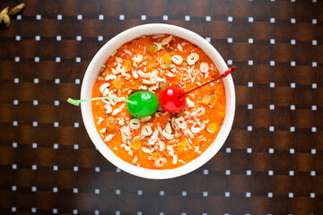 Gajar Ka Halwa served in a dish isolated on table background top view of bangladesh food - obrazy, fototapety, plakaty
