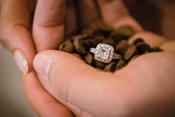 Handful of chocolate chips with engagement ring for proposal