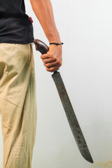 Man holding machete isolated white background.
