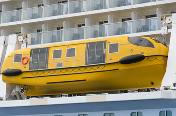 Yellow lifeboat on cruise ship