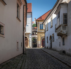 Old Town alley street with Bratislava Castle on background - Bratislava, Slovakia