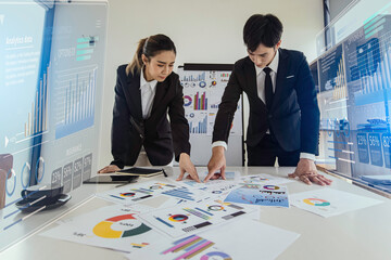Technology and financial advisory services concert. Business teamwork and working on digital laptop computer with advisor showing plan of investment to clients at table office. Digital marketing.