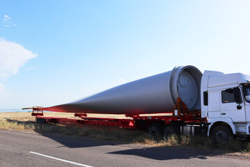 the blade of a windmill on a truck. environmental generator. ecology. energy