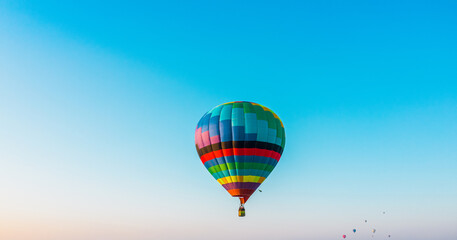 Hot air balloon festival, hot air balloon against the blue sky, drone view, aerial photography