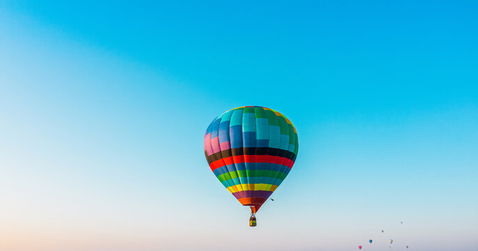 Hot air balloon festival, hot air balloon against the blue sky, drone view, aerial photography