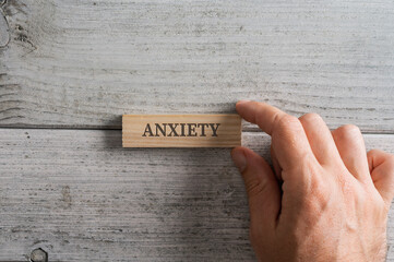 Wooden peg with the word Anxiety on it