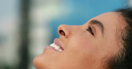 African black woman looking upwards to the sky