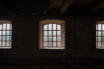Medieval windows in old building as an dark architectural background