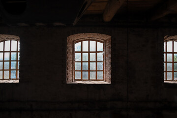Fototapeta premium Medieval windows in old building as an dark architectural background