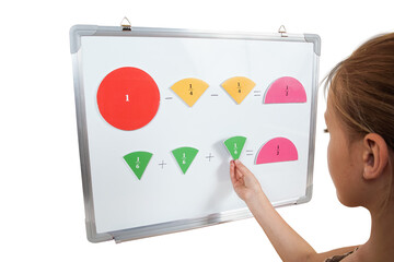 Little preschooler girl on magnetic interactive white borad is studying addition and subtraction in...