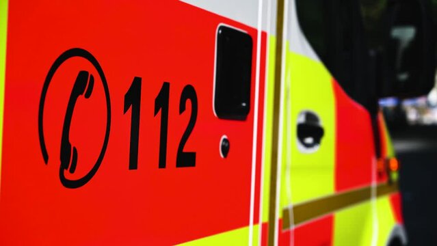 Emergency call number 112. Ambulance car on the street in Germany. 