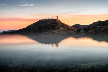 Reflections of an abandoned radar base at sunset, Northern Italy