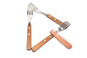 3 forks and 1 wooden handle making the letter Q on a white background