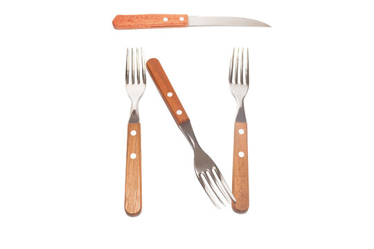3 forks and 1 knife with a wooden handle making the letter Ñ on a white background