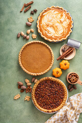 Traditional fall Thanksgiving pies, pumpkin and pecan pie © fahrwasser