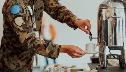 Close-up photo of soldier serving themselves in a modern hotel during a dinner party. Selective focus