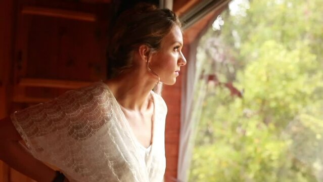 Bride getting ready for elopement in a cabin