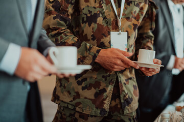 Close-up photo of soldier serving themselves in a modern hotel during a dinner party. Selective...