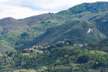 Fototapeta na wymiar Tuscany. A village in a valley near the town of Barga. An old hill town in Italy.