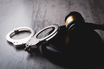 Legal law concept image - gavel and handcuffs