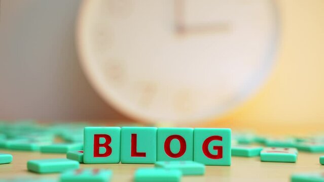 Online marketing, content creation, sharing your life on social media. The word BLOG made of colorful scrabble tiles. High quality 4k footage