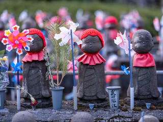 Jizo statues at the Zojoji temple in Tokyo, Japan