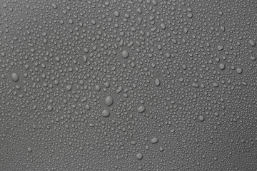 View of many water drops on grey background