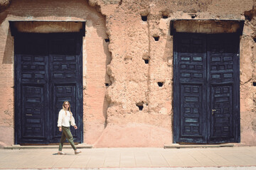 woman and old door in an old building