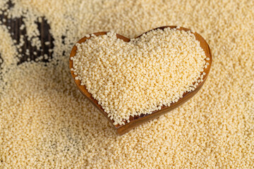 Fresh raw porridge couscous from wheat or millet