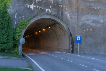 Illuminated tunnel through a mountain