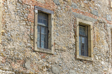 Fototapeta na wymiar Old medieval windows on the wall of the Old Castle and town Ozalj