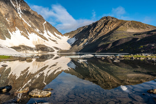 Incredible alpine lake in Yukon Territory, near Alaska & Canada. Snow capped mountains and glacier. © Scalia Media