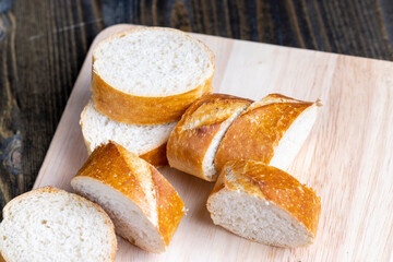 sliced into pieces a long baguette with a crispy crust