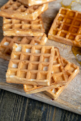 square sweet soft waffles in bee honey