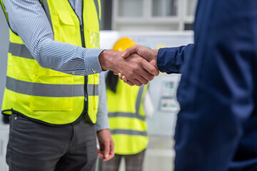 After concluding the meeting, competent investor shakes hands with engineer. Concept of the...