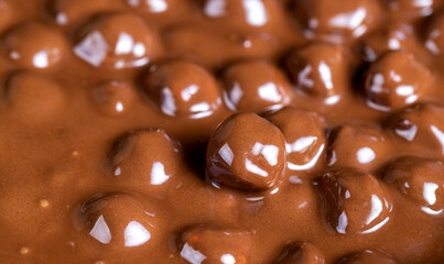 real milk chocolate while cooking with hazelnuts