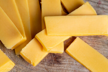 Sliced yellow cheese made from cow's milk
