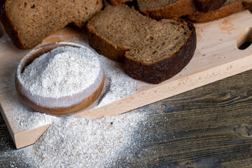 sliced rye bread on a wooden table, close up