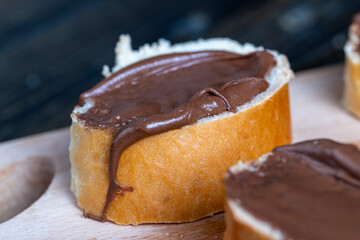 Chocolate butter spread on bread while cooking breakfast