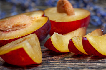 Ripe plum on a wooden table