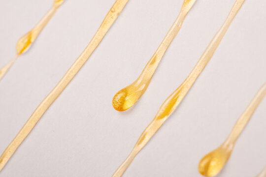 cannabis wax resin dripping down white paper closeup