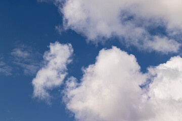 Clouds floating across the sky in the daytime