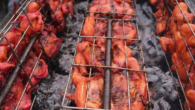 Ayam golek grilled chicken is rotate burn by charcoal fire. Delicious Malaysia street food