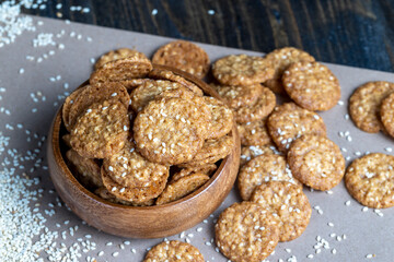oatmeal thin round cookies with lots of sesame seeds