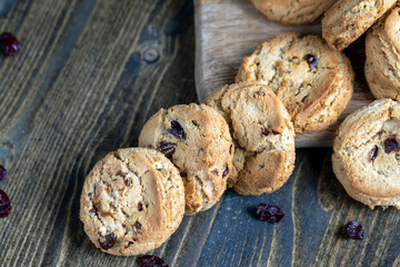 delicious dried cookies made of high-quality flour with dried red cranberries on the table