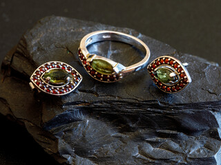 Women's jewelry set earrings in eye shape and ring with Czech red garnet and green moldavit or...