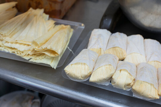 Fresh corn tamales being prepared