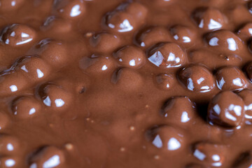 real milk chocolate while cooking with hazelnuts